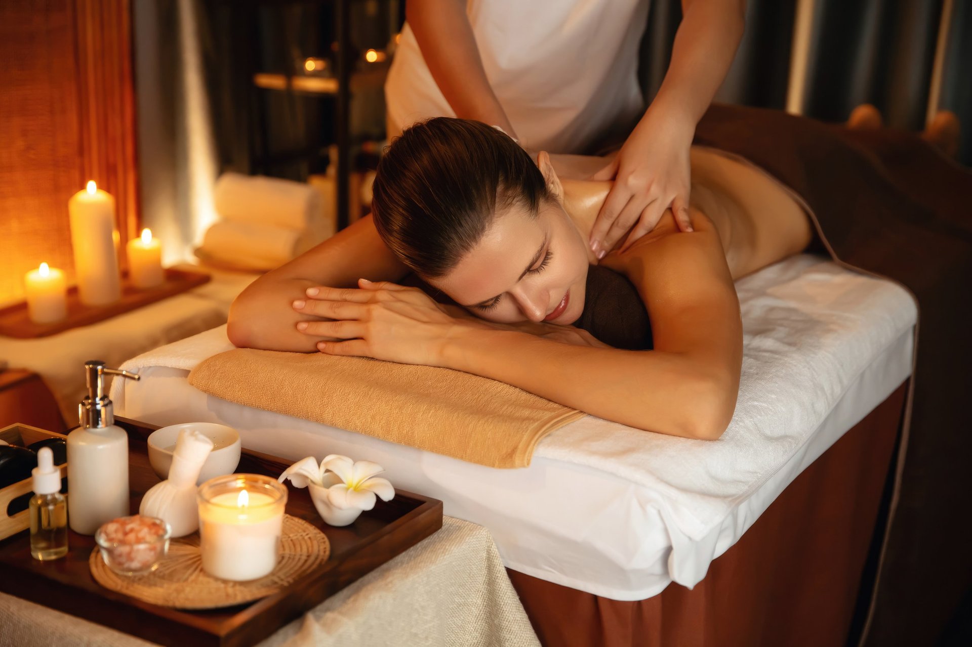 Luxury spa massage with candles and serene atmosphere